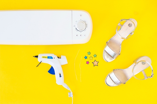 Heels, glue gun, stickers, and machine 