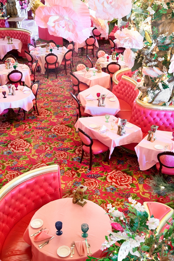 Pink couches and chairs in a room