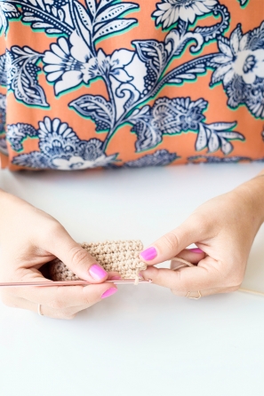 Someone sewing something beige 