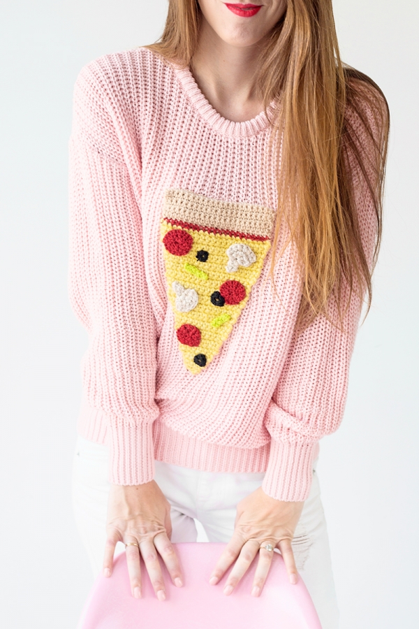 Someone wearing a pizza sweater