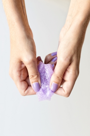 Someone holding a purple styrofoam ring