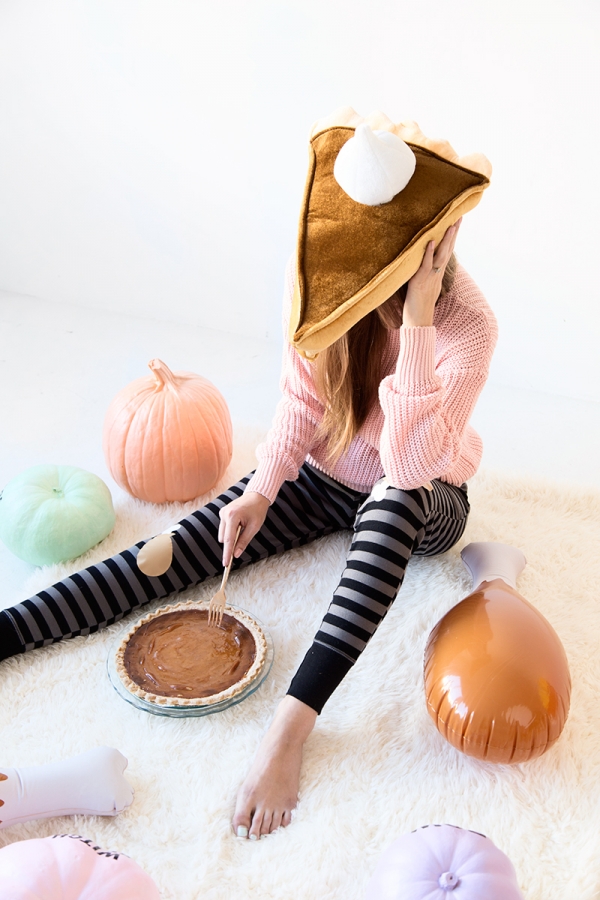 Someone eating pie with a pie hat on