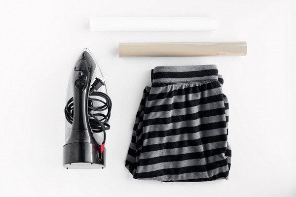 Pants, an iron, and paper