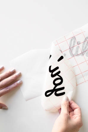 Someone peeling off a paper