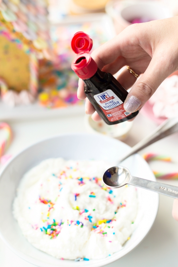 Someone holding vanilla extract