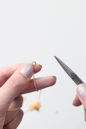 Someone using tools and jewelry