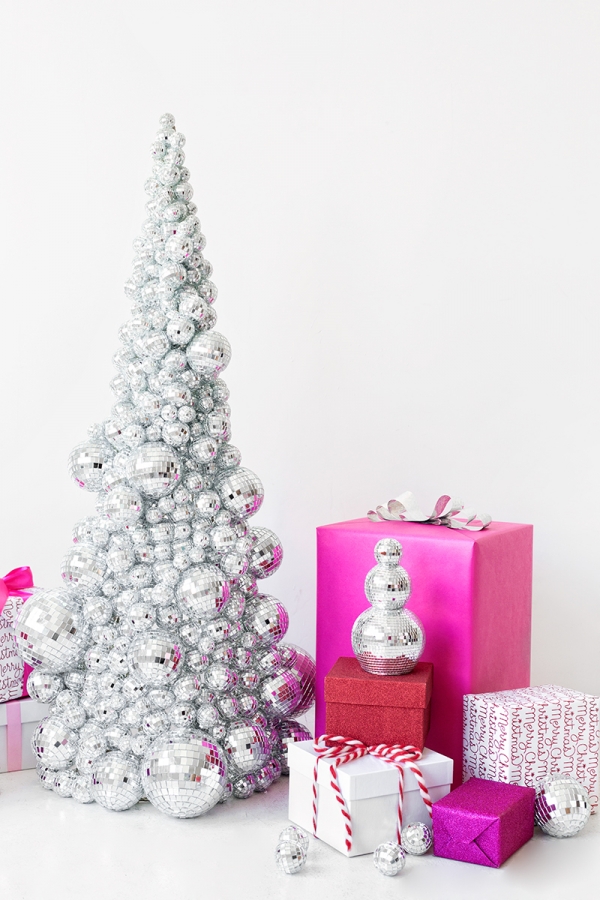 A disco ball Christmas tree and pink presents