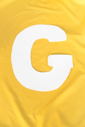 Yellow fabric and white paper