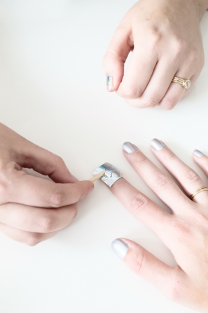 A woman getting her nails painted