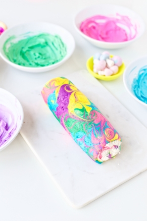 Rainbow yule log dessert and frosting