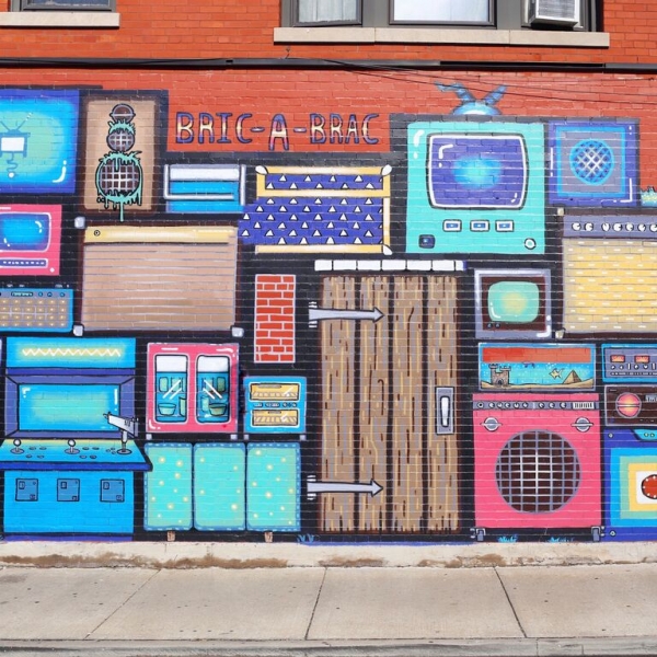 A wall with painted doors and machines 