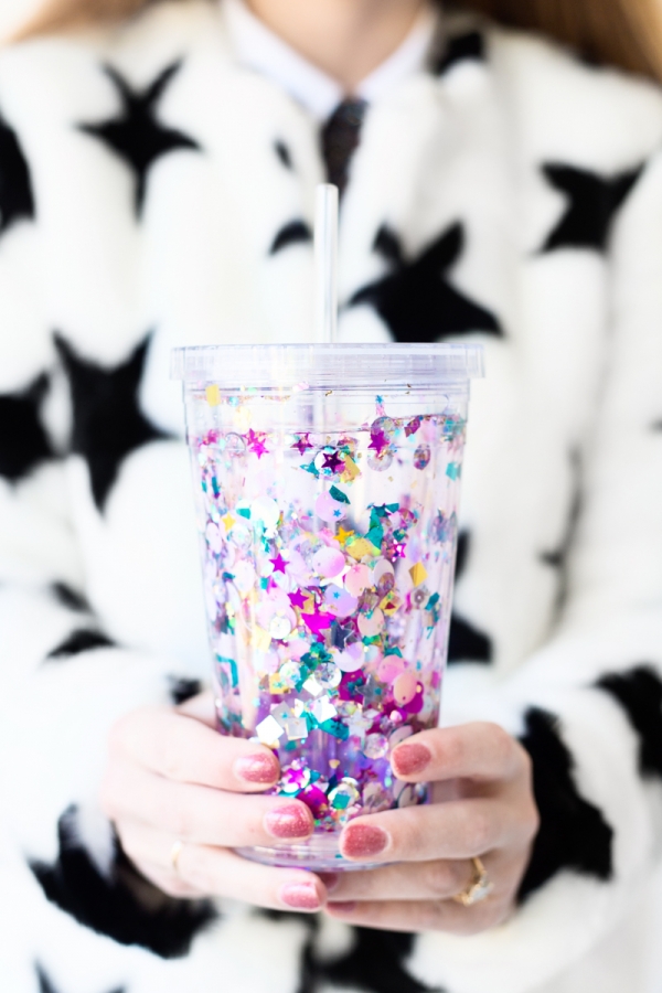 Someone holding a cup with glitter