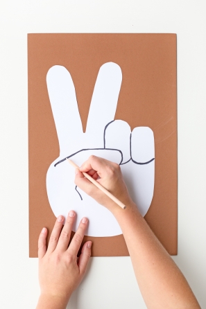 Someone drawing on a white paper