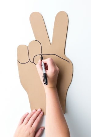 Someone drawing on cardboard