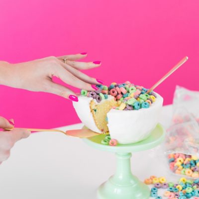DIY Cereal Bowl Cake A cereal cake and a hand
