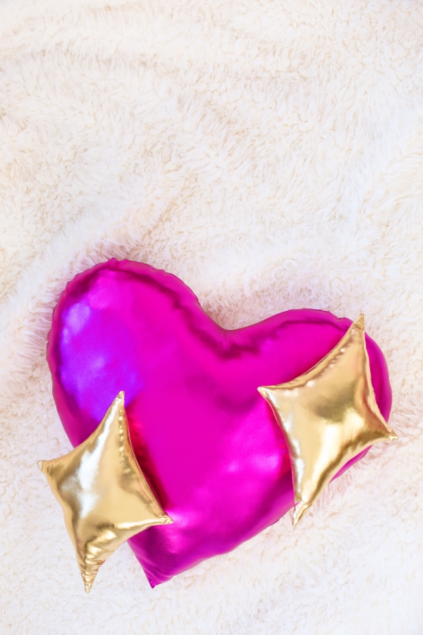 A gold and pink pillow