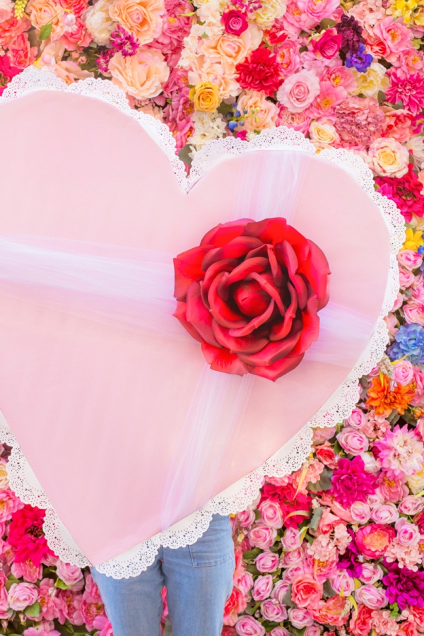 A pink heart with a rose on it