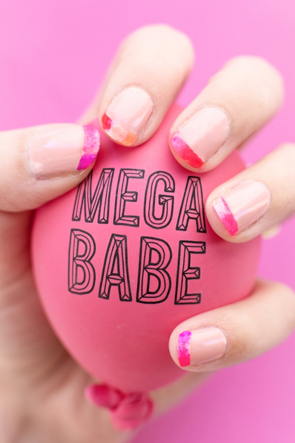 Someone holding ball that says \"mega babe\"