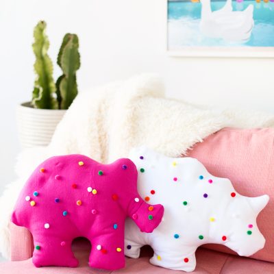 DIY Circus Animal Cookie Pillows Circus animal cookie pillows on a pink couch
