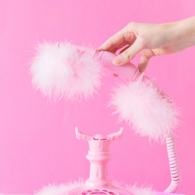 Someone holding a pink phone