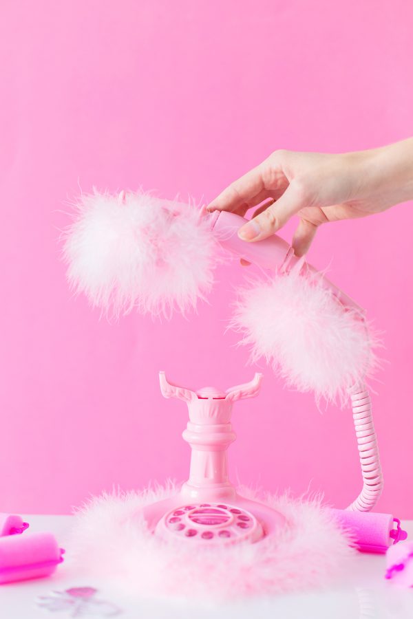 Someone holding a pink phone