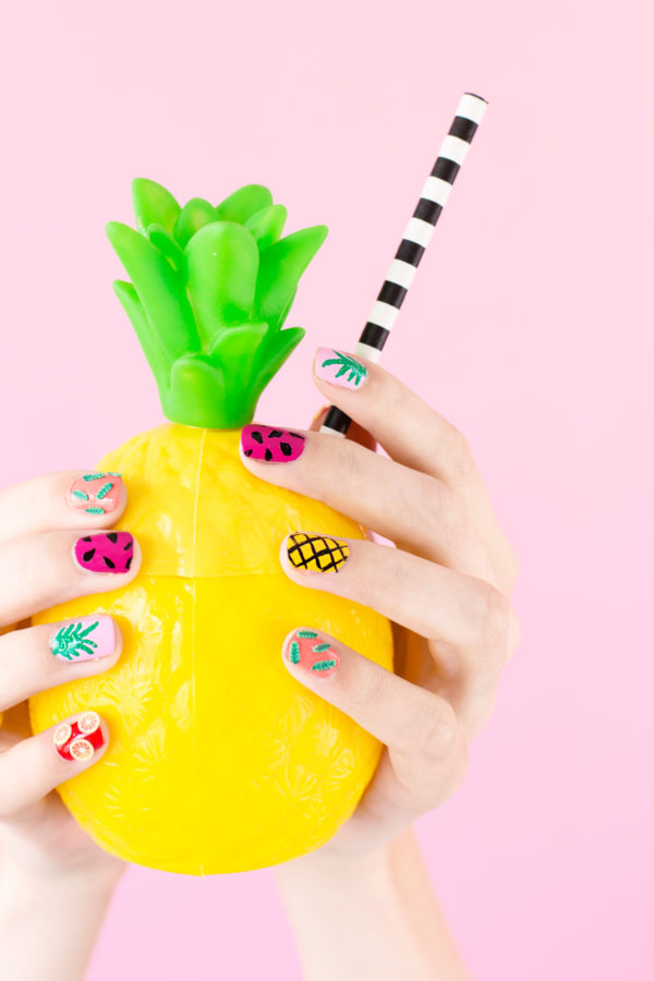 Someone holding a pineapple cup