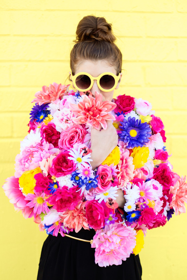 A woman wearing a floral jacket