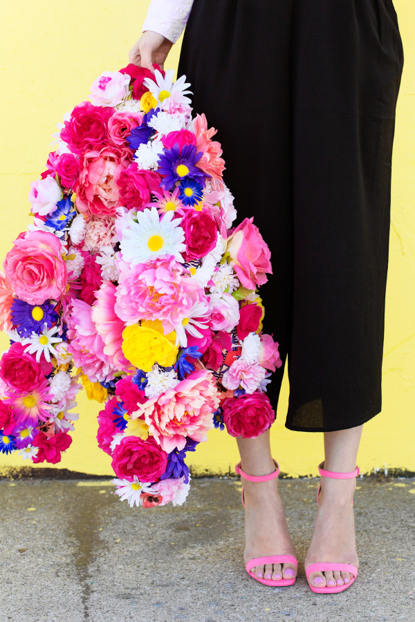 Someone holding a floral jacket