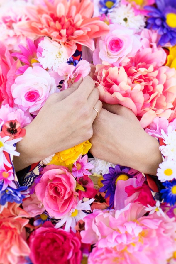 Someone holding a floral jacket