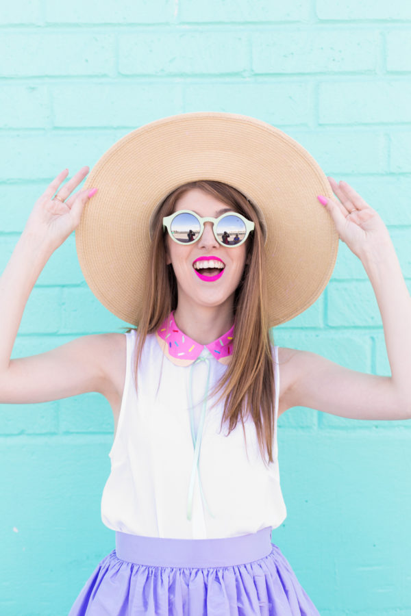A woman wearing sunglasses and a hat