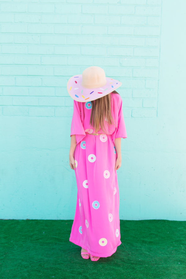 A woman wearing a pink dress