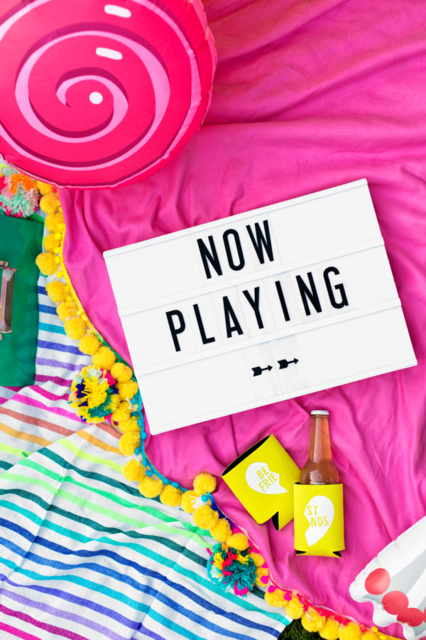 A sign that says \"now playing\"