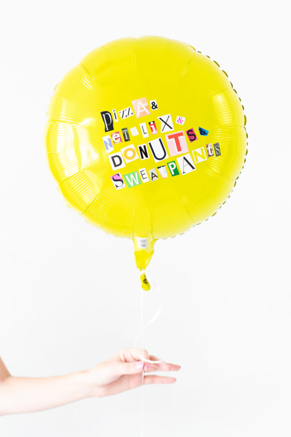Yellow balloon with words on it
