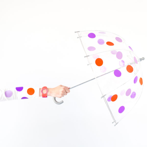Someone holding a polka dot umbrella