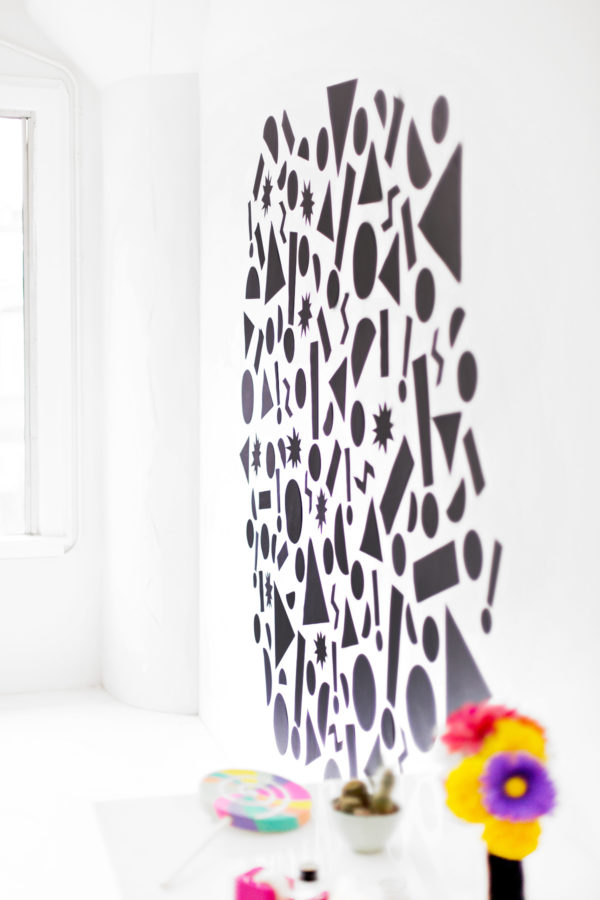Black shapes on a white wall