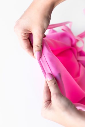 Someone holding pink fabric