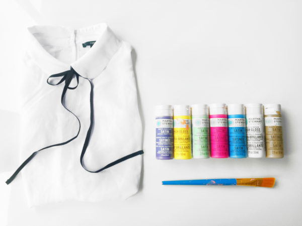 A white hat and paint tubes