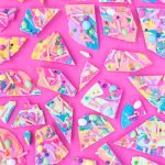 Colorful candy on a pink table