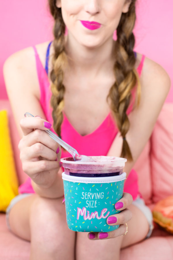 A woman holding a cup, with Tillamook and Cream