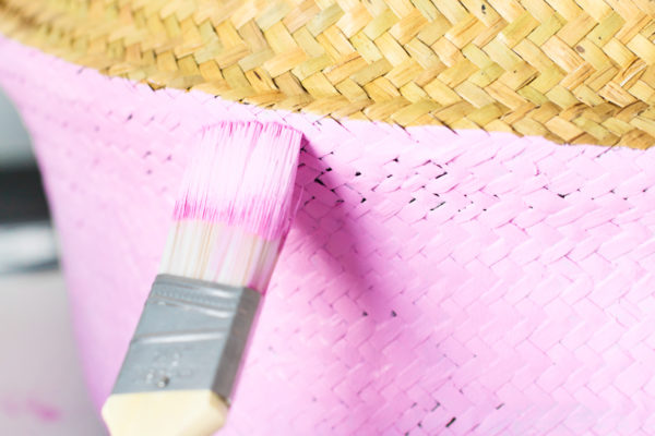 Paint brush and pink laundry basket