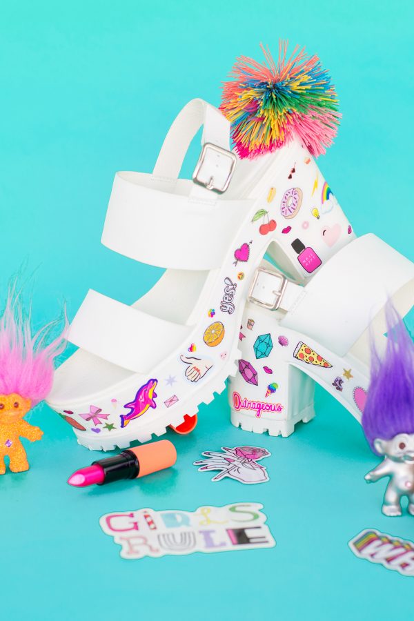 White heels with stickers on them