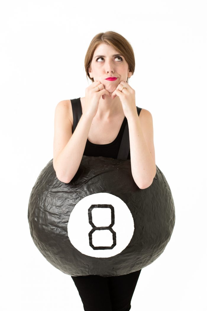 A person wearing an eight ball costume