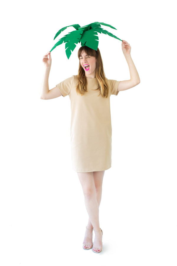 A woman wearing a palm tree costume