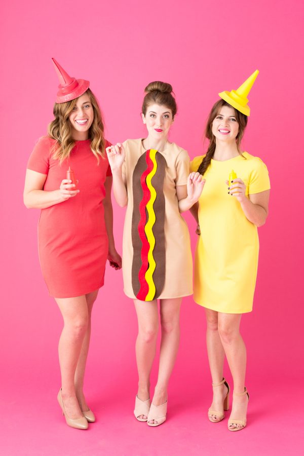 Hot Dog Trio Costumes Three people dressed as a hot dog, ketchup, and mustard.
