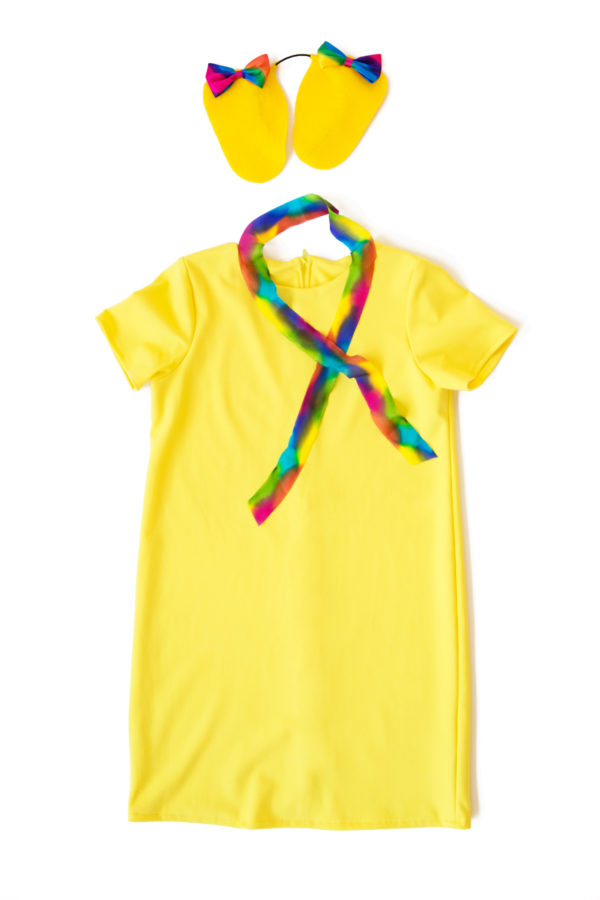 A yellow dress and rainbow scarf