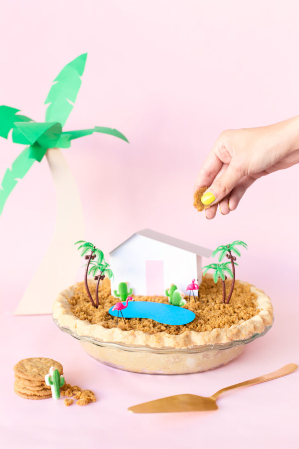 A house with a mini house and trees on it