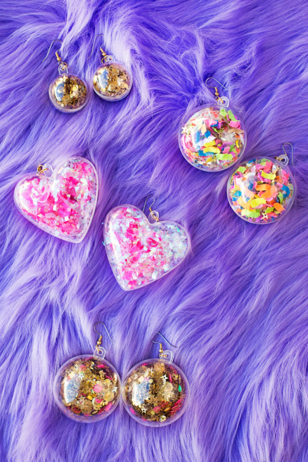 Confetti earrings on purple fur fabric