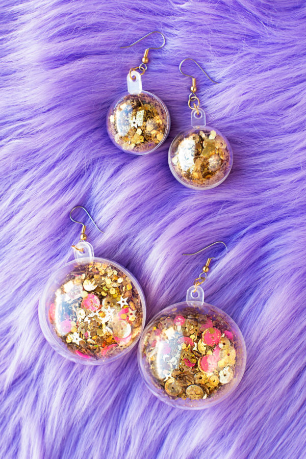 Confetti earrings on purple fur fabric