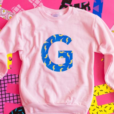 DIY Graphic Initial Sweatshirts A pink crewneck with a G on it