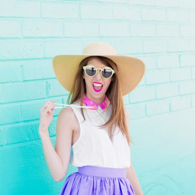 A Review of 2016 + What to Expect in 2017! A woman wearing a hat standing in front of a blue wall